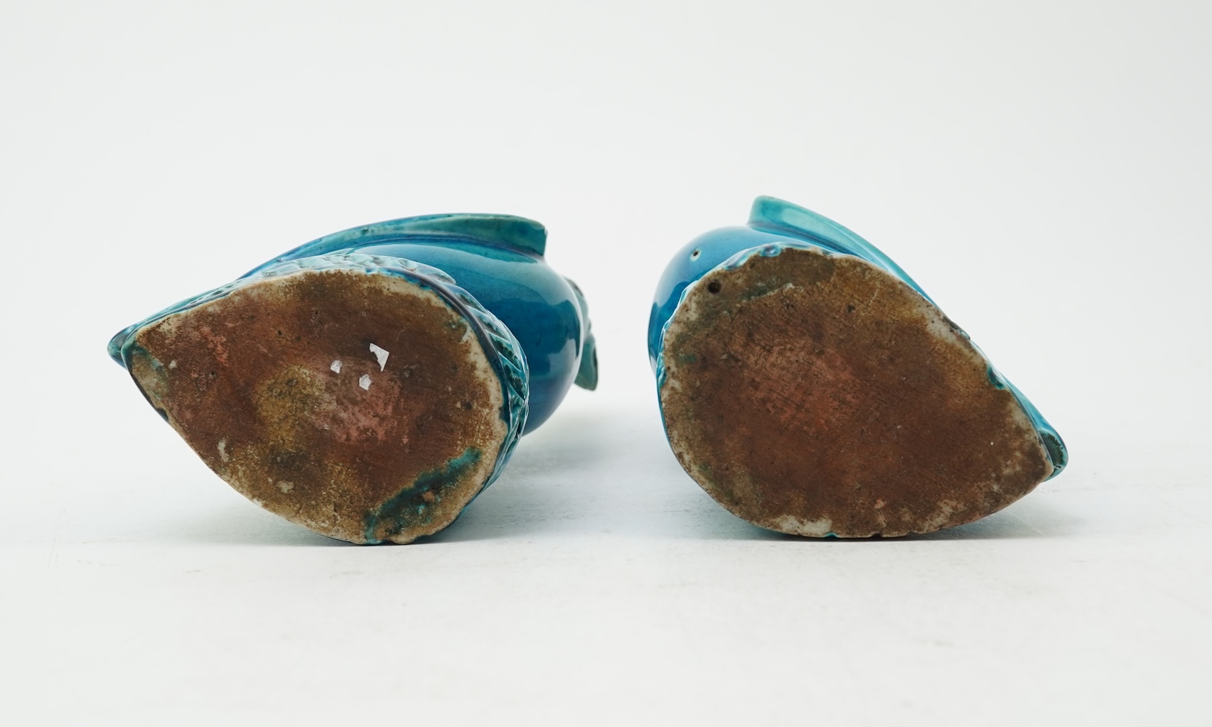 A pair of Chinese turquoise glazed models of parrots, 18th century